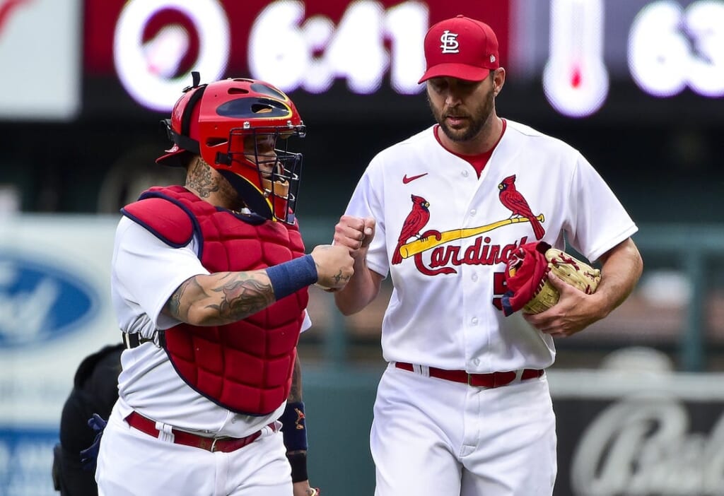 St. Louis Cardinals starting pitcher Adam Wainwright (50) and catcher Yadier Molina (4) walk in from the bullpen before a game against the Milwaukee Brewers at Busch Stadium. Mandatory Credit: Jeff Curry-USA TODAY Sports