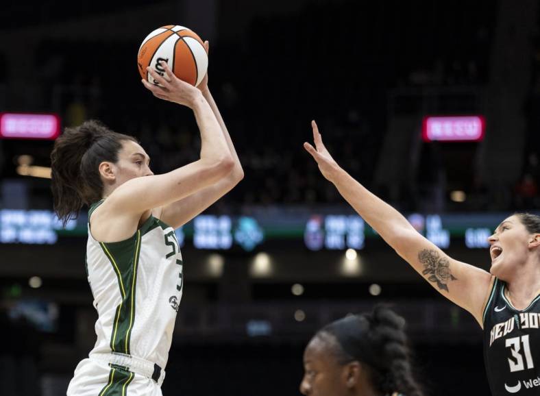 May 29, 2022; Seattle, Washington, USA; Seattle Storm forward Breanna Stewart (30) shoots the ball over New York Liberty center Stefanie Dolson (31) during the first half at Climate Pledge Arena. Mandatory Credit: Stephen Brashear-USA TODAY Sports