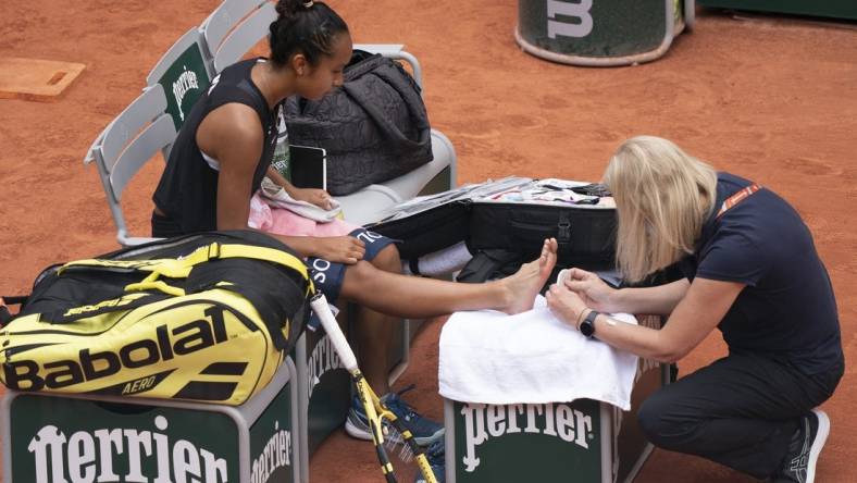 May 31, 2022; Paris, France; Leylah Fernandez (CAN) receives treatment on her foot during her match against Martina Trevisan (ITA)  on day 10 of the French Open at Stade Roland-Garros. Mandatory Credit: Susan Mullane-USA TODAY Sports