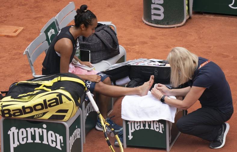 May 31, 2022; Paris, France; Leylah Fernandez (CAN) receives treatment on her foot during her match against Martina Trevisan (ITA)  on day 10 of the French Open at Stade Roland-Garros. Mandatory Credit: Susan Mullane-USA TODAY Sports