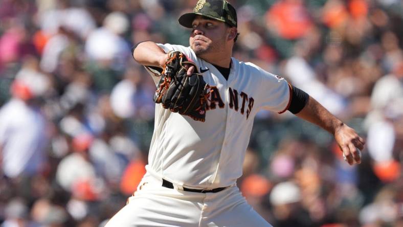 May 21, 2022; San Francisco, California, USA; San Francisco Giants relief pitcher Jose Alvarez (48) throws a pitch against the San Diego Padres during the ninth inning at Oracle Park. Mandatory Credit: Darren Yamashita-USA TODAY Sports