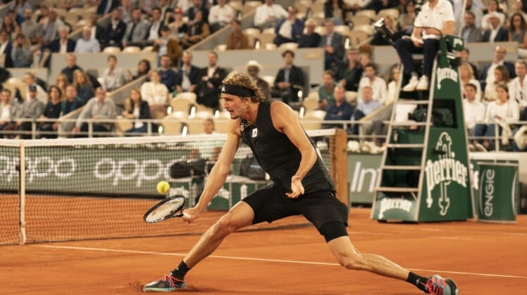 June 3, 2022; Paris, France; Alexander Zverev (GER) returns a shot during his semifinal match against Rafael Nadal (ESP)on day 13 of the French Open at Stade Roland-Garros. Mandatory Credit: Susan Mullane-USA TODAY Sports
