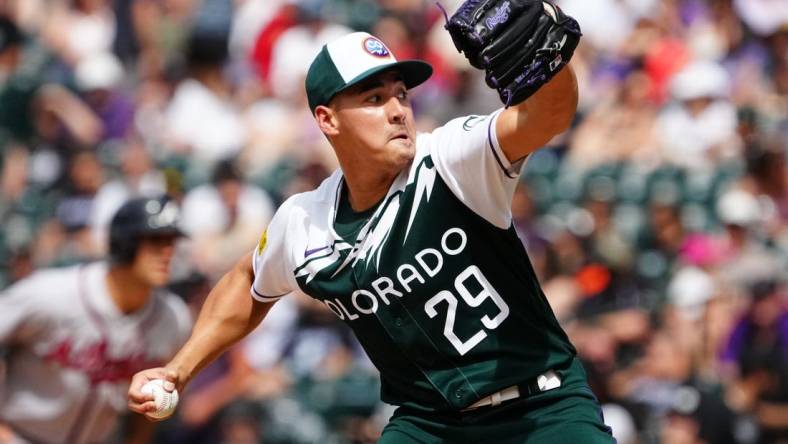 Jun 5, 2022; Denver, Colorado, USA; Colorado Rockies relief pitcher Robert Stephenson (29) delivers a pitch in the seventh against the Atlanta Braves at Coors Field. Mandatory Credit: Ron Chenoy-USA TODAY Sports