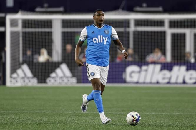 Apr 16, 2022; Foxborough, Massachusetts, USA; Charlotte FC defender Christian Makoun (14) during the first half against the New England Revolution at Gillette Stadium. Mandatory Credit: Winslow Townson-USA TODAY Sports