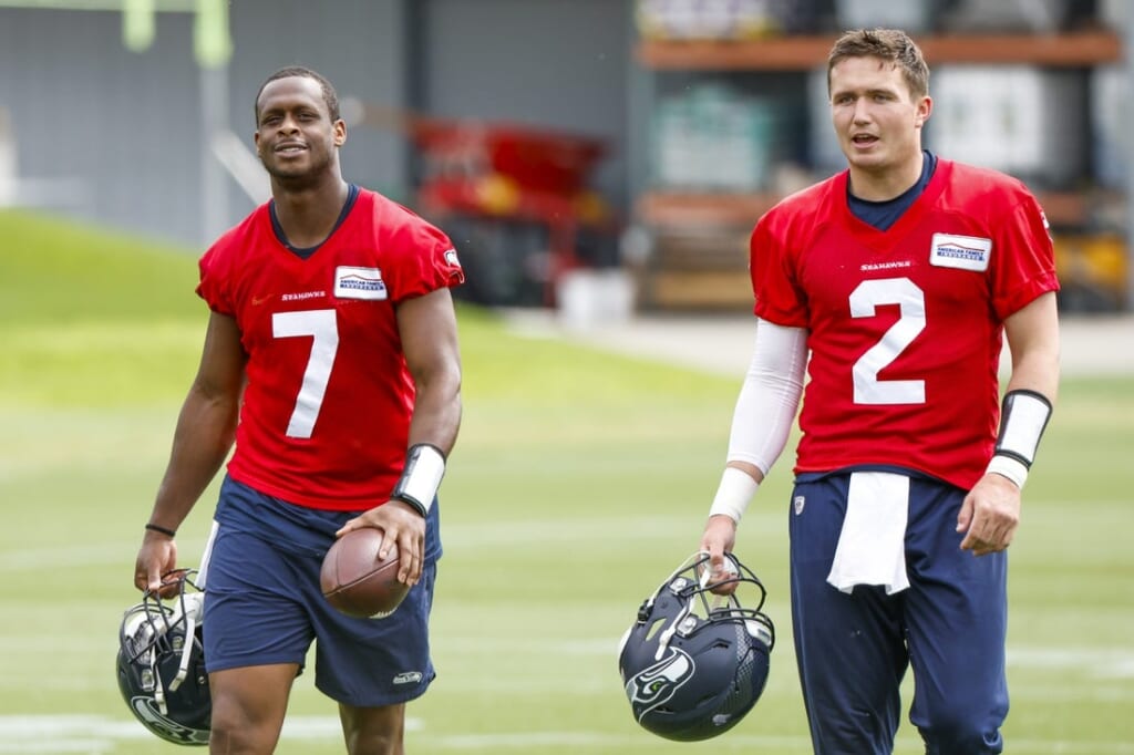 Jun 7, 2022; Renton, Washington, USA; Seattle Seahawks quarterback Geno Smith (7) and quarterback Drew Lock (2) return to the locker room following  minicamp practice at the Virginia Mason Athletic Center Field. Mandatory Credit: Joe Nicholson-USA TODAY Sports