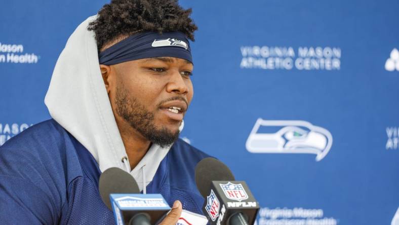 Jun 7, 2022; Renton, Washington, USA; Seattle Seahawks running back Rashaad Penny (20) talks during a press conference following a minicamp practice at the Virginia Mason Athletic Center Field. Mandatory Credit: Joe Nicholson-USA TODAY Sports