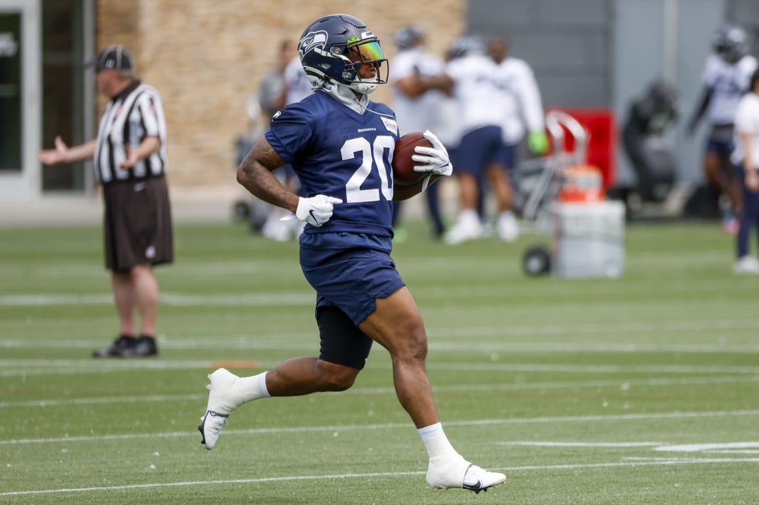 Jun 7, 2022; Renton, Washington, USA; Seattle Seahawks running back Rashaad Penny (20) rushes a drill during minicamp practice at the Virginia Mason Athletic Center Field. Mandatory Credit: Joe Nicholson-USA TODAY Sports