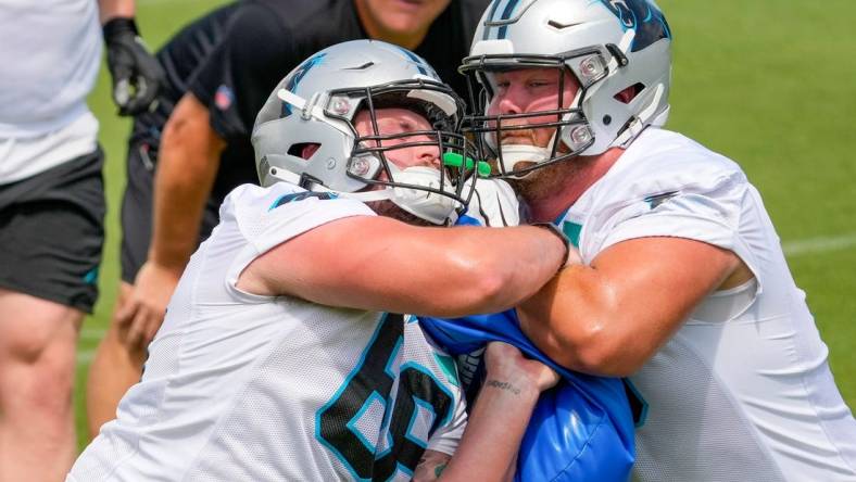 Jun 8, 2022; Charlotte, North Carolina, USA; Carolina Panthers center Sam Tecklenburg (68) drills with center Bradley Bozeman (56) during Carolina Panthers minicamp at Bank of America Stadium Practice Facility. Mandatory Credit: Jim Dedmon-USA TODAY Sports