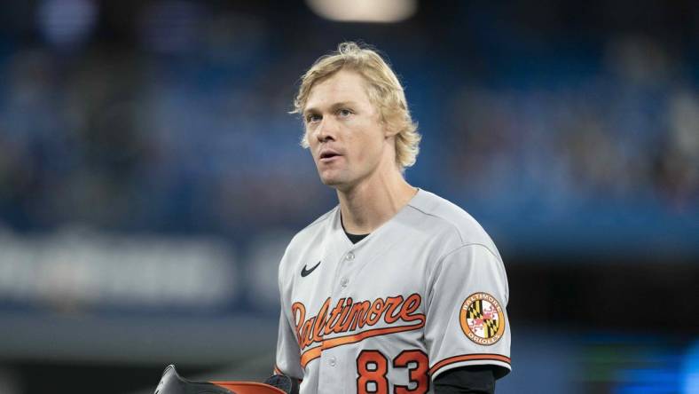 Jun 13, 2022; Toronto, Ontario, CAN; Baltimore Orioles outfielder Kyle Stowers (83) walks towards the dugout after hitting an RBI double during his MLB debut against the Toronto Blue Jays during the seventh inning at Rogers Centre. Mandatory Credit: Nick Turchiaro-USA TODAY Sports