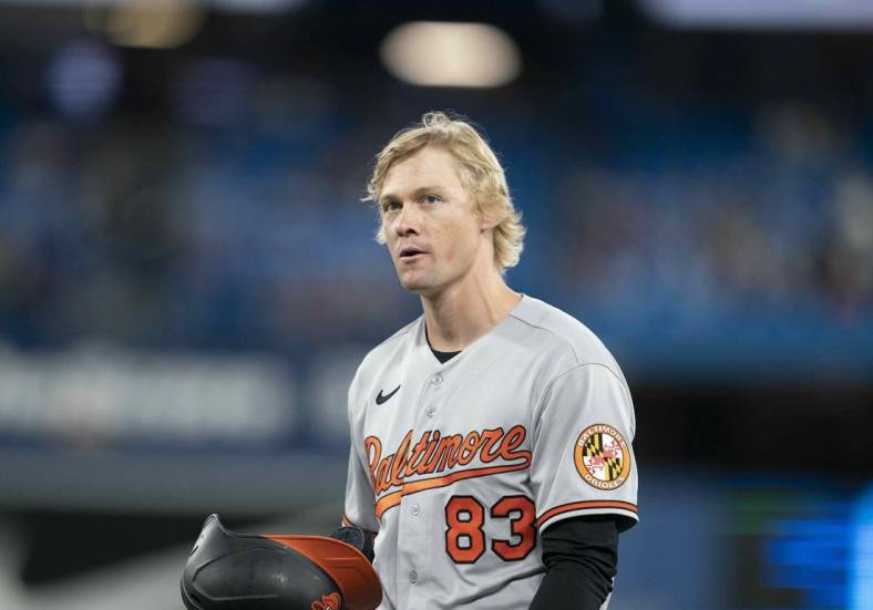 Jun 13, 2022; Toronto, Ontario, CAN; Baltimore Orioles outfielder Kyle Stowers (83) walks towards the dugout after hitting an RBI double during his MLB debut against the Toronto Blue Jays during the seventh inning at Rogers Centre. Mandatory Credit: Nick Turchiaro-USA TODAY Sports