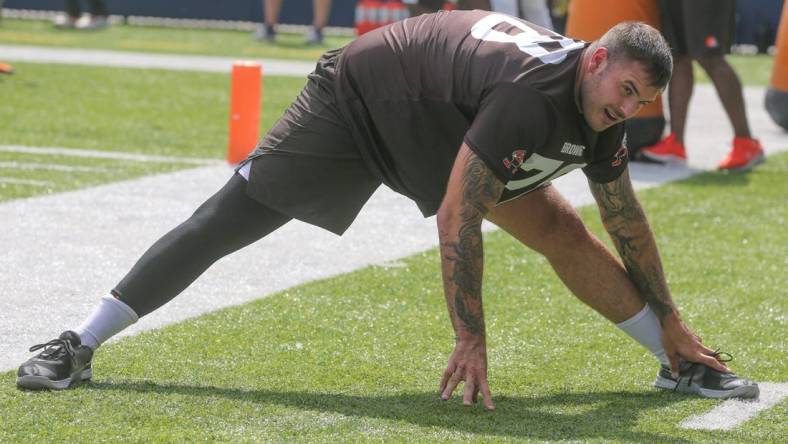 Cleveland Browns offensive lineman Jack Conklin stretches before minicamp on Wednesday, June 15, 2022 in Canton, Ohio, at Tom Benson Hall of Fame Stadium.

Browns Hof 3