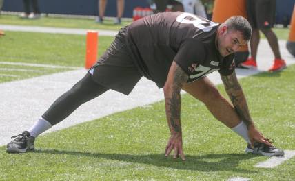 Cleveland Browns offensive lineman Jack Conklin stretches before minicamp on Wednesday, June 15, 2022 in Canton, Ohio, at Tom Benson Hall of Fame Stadium.

Browns Hof 3
