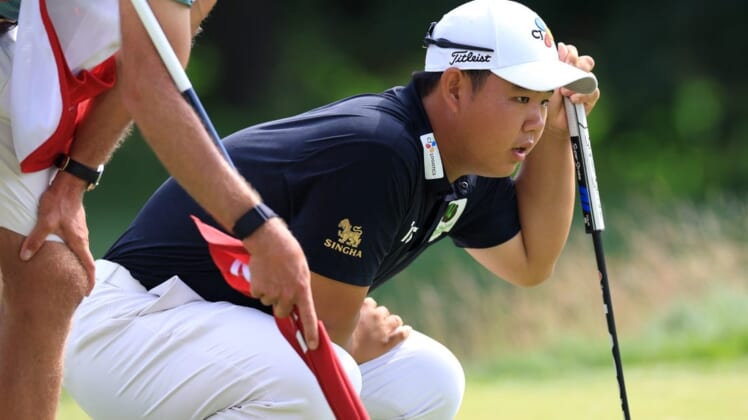Jun 17, 2022; Brookline, Massachusetts, USA; Joohyung Kim lines up a putt during the second round of the U.S. Open golf tournament. Mandatory Credit: Aaron Doster-USA TODAY Sports