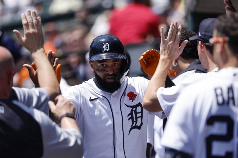 May 30, 2022; Detroit, Michigan, USA;  Detroit Tigers center fielder Derek Hill (54) receives congratulations from teammates after he hits a home run in the third inning against the Minnesota Twins at Comerica Park. Mandatory Credit: Rick Osentoski-USA TODAY Sports