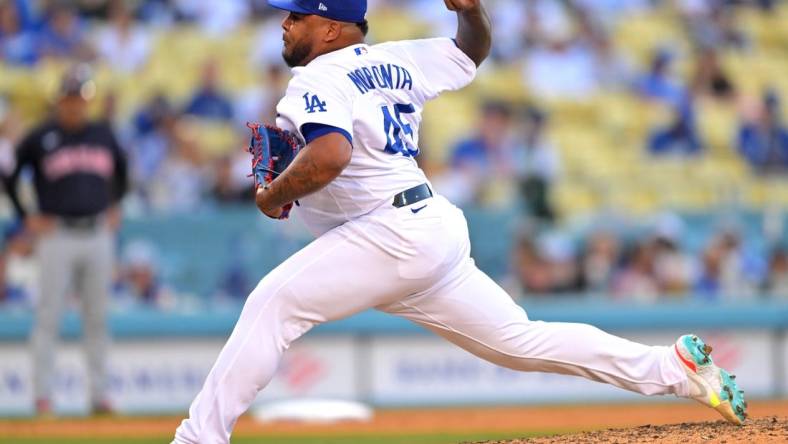 Jun 18, 2022; Los Angeles, California, USA;  Los Angeles Dodgers relief pitcher Reyes Moronta (45) throws a scoreless ninth against the Cleveland Guardians at Dodger Stadium. Mandatory Credit: Jayne Kamin-Oncea-USA TODAY Sports