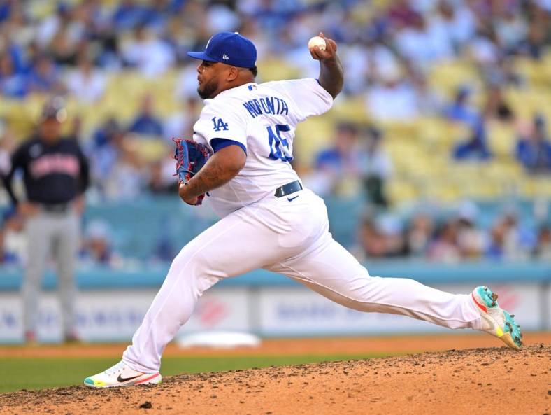 Jun 18, 2022; Los Angeles, California, USA;  Los Angeles Dodgers relief pitcher Reyes Moronta (45) throws a scoreless ninth against the Cleveland Guardians at Dodger Stadium. Mandatory Credit: Jayne Kamin-Oncea-USA TODAY Sports