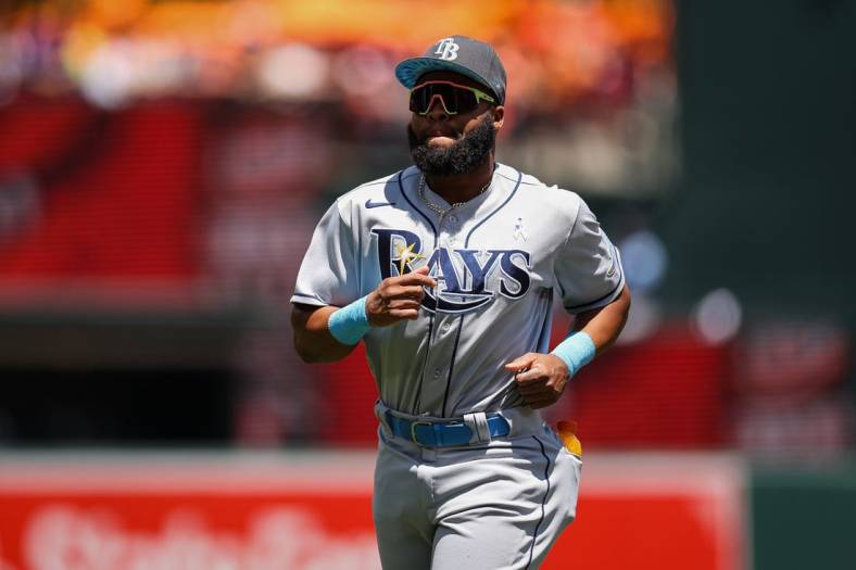 Jun 19, 2022; Baltimore, Maryland, USA; Tampa Bay Rays left fielder Manuel Margot (13) runs on the field before the game against the Baltimore Orioles at Oriole Park at Camden Yards. Mandatory Credit: Scott Taetsch-USA TODAY Sports