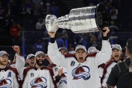 Jun 26, 2022; Tampa, Florida, USA; Colorado Avalanche defenseman Jack Johnson (3) celebrates with the Stanley Cup after the Avalanche game against the Tampa Bay Lightning in game six of the 2022 Stanley Cup Final at Amalie Arena. Mandatory Credit: Geoff Burke-USA TODAY Sports