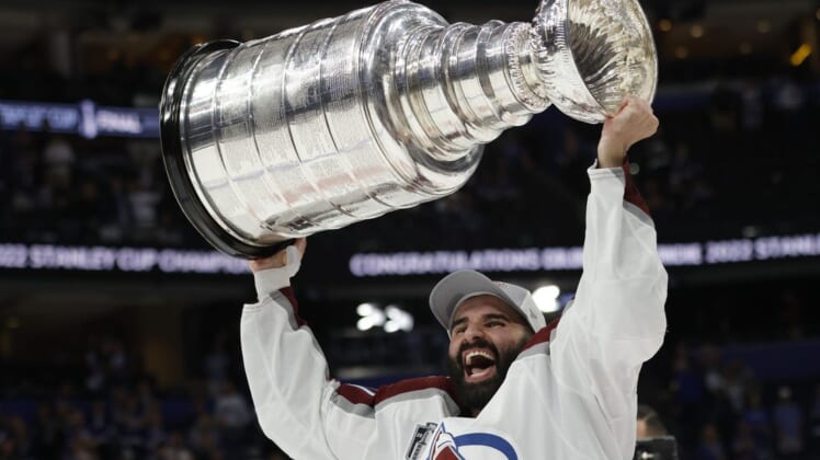 Jun 26, 2022; Tampa, Florida, USA; Colorado Avalanche center Nazem Kadri (91) celebrates with the Stanley Cup after the Avalanche game against the Tampa Bay Lightning in game six of the 2022 Stanley Cup Final at Amalie Arena. Mandatory Credit: Geoff Burke-USA TODAY Sports