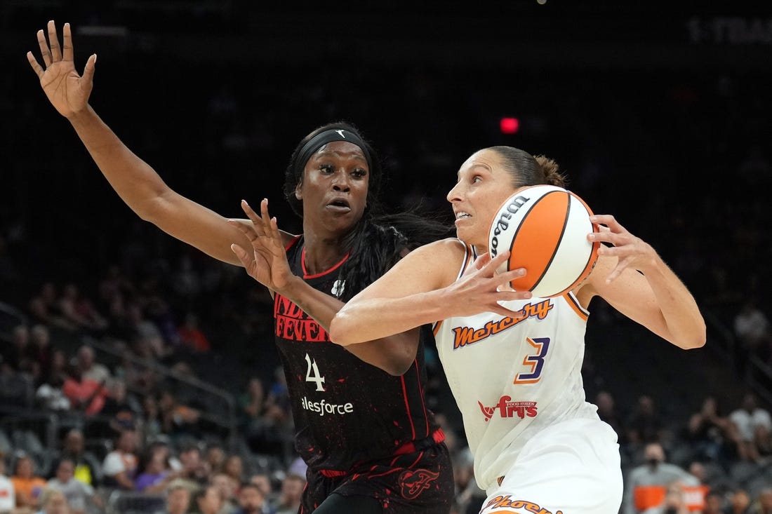 Jun 29, 2022; Phoenix, Arizona, USA; Phoenix Mercury guard Diana Taurasi (3) drives against Indiana Fever center Queen Egbo (4) during the first half at Footprint Center. Mandatory Credit: Joe Camporeale-USA TODAY Sports