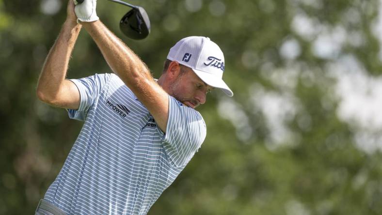 Jun 30, 2022; Silvis, Illinois, USA; Webb Simpson of Charlotte North Carolina tees off on the 15th hole during the first round of the John Deere Classic golf tournament. Mandatory Credit: Marc Lebryk-USA TODAY Sports