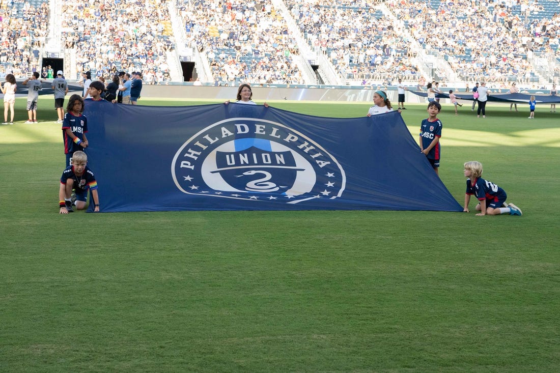 Jun 26, 2022; Philadelphia, Pennsylvania, USA; Young fans hold up the Philadelphia Union flag prior to the game against New York City FC at Subaru Park. Mandatory Credit: Gregory Fisher-USA TODAY Sports