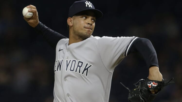 Jul 6, 2022; Pittsburgh, Pennsylvania, USA; New York Yankees relief pitcher Albert Abreu (84) throws a pitch against the Pittsburgh Pirates during the ninth inning at PNC Park. Mandatory Credit: Charles LeClaire-USA TODAY Sports