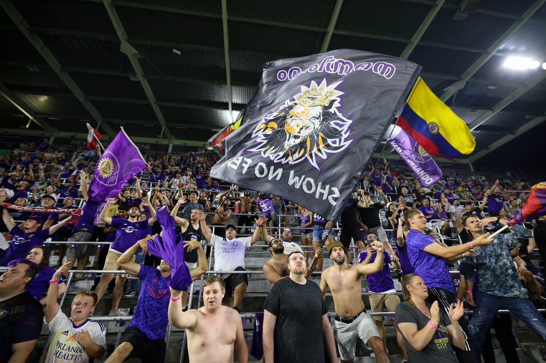 Jul 9, 2022; Orlando, Florida, USA; Fans celebrate after Orlando City beats Inter Miami at Exploria Stadium. Mandatory Credit: Nathan Ray Seebeck-USA TODAY Sports