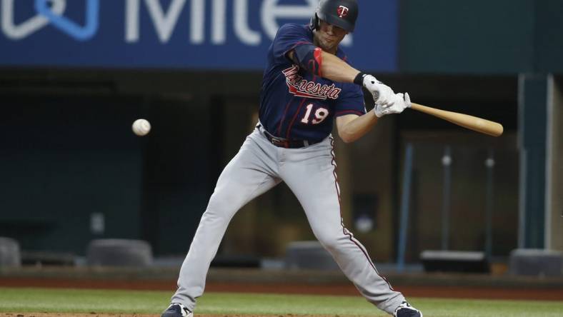 Jul 10, 2022; Arlington, Texas, USA; Minnesota Twins left fielder Alex Kirilloff (19) singles in the first inning against the Texas Rangers at Globe Life Field. Mandatory Credit: Tim Heitman-USA TODAY Sports