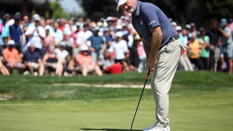 Jerry Kelly watches as his putt for par falls into the cup to win the Bridgestone Senior Players Championship at Firestone Country Club on Sunday.

Bridgestone 4