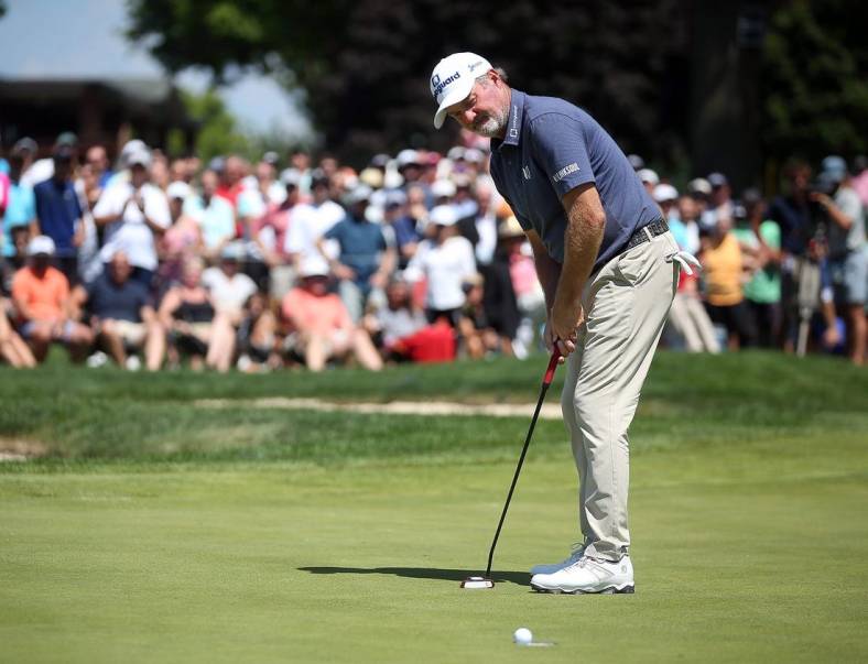 Jerry Kelly watches as his putt for par falls into the cup to win the Bridgestone Senior Players Championship at Firestone Country Club on Sunday.

Bridgestone 4
