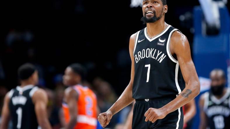 Nets forward Kevin Durant (7) reacts after a play against the Thunder during Brooklyn's 120-96 win on Nov. 14, 2021, at Paycom Center.

cutout