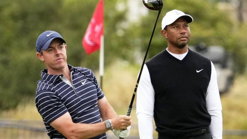 Jul 11, 2022; St. Andrews, SCT; Rory McIlroy and Tiger Woods during the R&A Celebration of Champions four-hole challenge at the 150th Open Championship golf tournament at St. Andrews Old Course. Mandatory Credit: Rob Schumacher-USA TODAY Sports