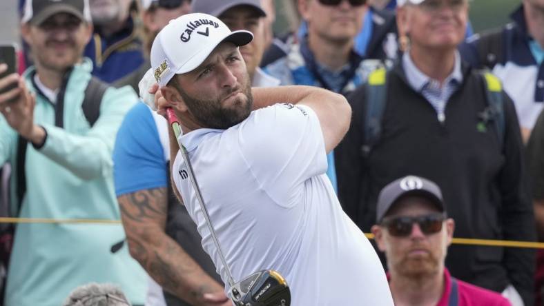 Jul 12, 2022; St. Andrews,Fife, SCT; Jon Rahm hits his tee shot on the 5th hole during a practice round for the 150th Open Championship golf tournament at St. Andrews Old Course. Mandatory Credit: Michael Madrid-USA TODAY Sports