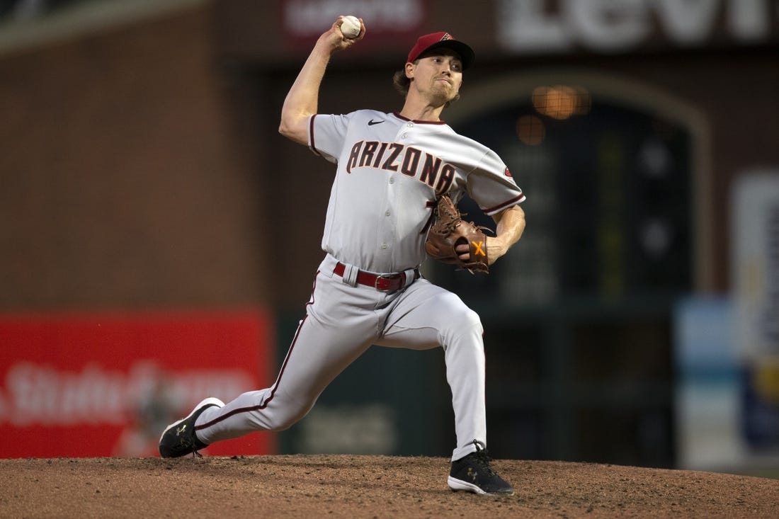 Jul 12, 2022; San Francisco, California, USA; Arizona Diamondbacks pitcher Luke Weaver (7) throws a pitch against the San Francisco Giants during the sixth inning at Oracle Park. Mandatory Credit: D. Ross Cameron-USA TODAY Sports