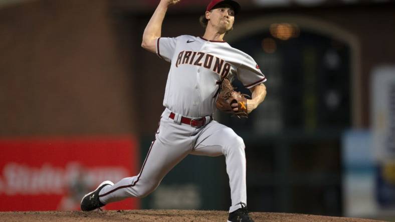 Jul 12, 2022; San Francisco, California, USA; Arizona Diamondbacks pitcher Luke Weaver (7) throws a pitch against the San Francisco Giants during the sixth inning at Oracle Park. Mandatory Credit: D. Ross Cameron-USA TODAY Sports