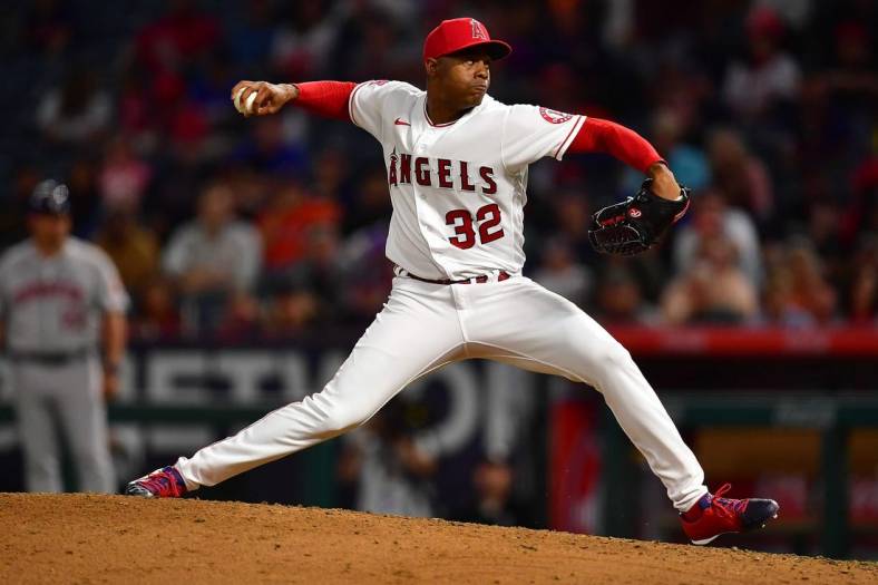 Jul 12, 2022; Anaheim, California, USA; Los Angeles Angels relief pitcher Raisel Iglesias (32) throws against the Houston Astros during the ninth inning at Angel Stadium. Mandatory Credit: Gary A. Vasquez-USA TODAY Sports
