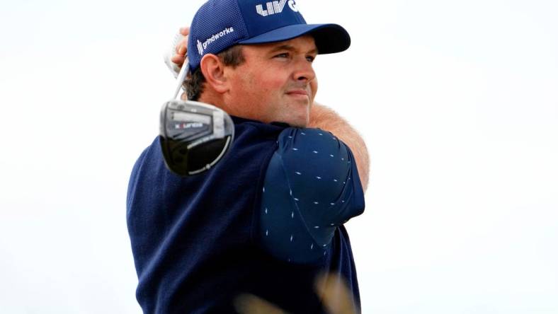 Jul 14, 2022; St. Andrews, SCT; Patrick Reed tees off on the sixth hole during the first round of the 150th Open Championship golf tournament at St. Andrews Old Course. Mandatory Credit: Rob Schumacher-USA TODAY Sports