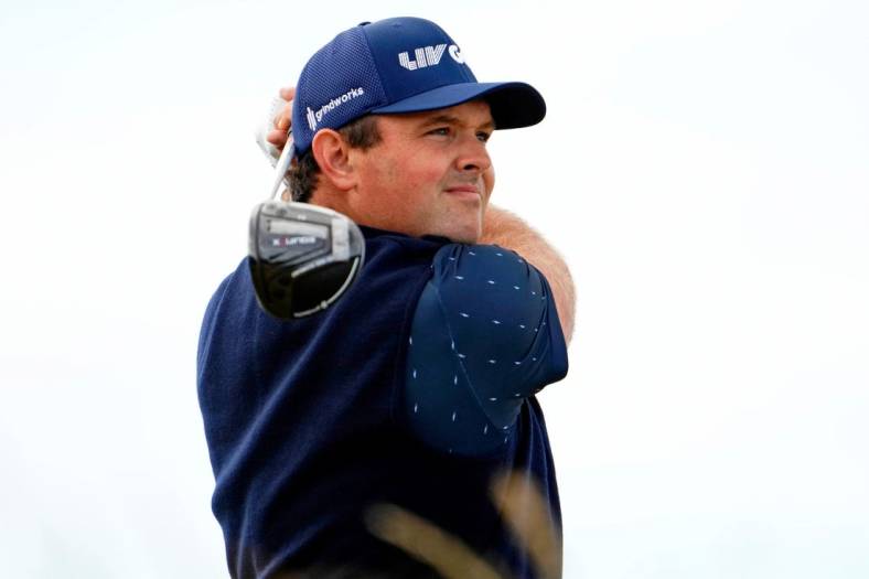 Jul 14, 2022; St. Andrews, SCT; Patrick Reed tees off on the sixth hole during the first round of the 150th Open Championship golf tournament at St. Andrews Old Course. Mandatory Credit: Rob Schumacher-USA TODAY Sports