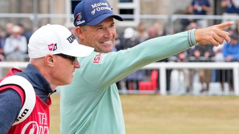 Jul 14, 2022; St. Andrews, SCT; Padraig Harrington smiles as he gestures while walking on the first fairway during the first round of the 150th Open Championship golf tournament at St. Andrews Old Course. Mandatory Credit: Michael Madrid-USA TODAY Sports