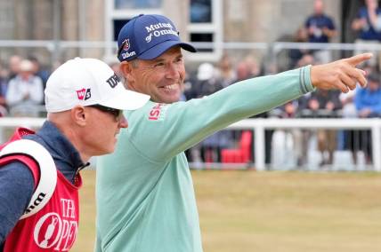 Jul 14, 2022; St. Andrews, SCT; Padraig Harrington smiles as he gestures while walking on the first fairway during the first round of the 150th Open Championship golf tournament at St. Andrews Old Course. Mandatory Credit: Michael Madrid-USA TODAY Sports