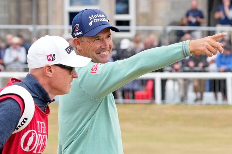 Jul 14, 2022; St. Andrews, SCT; Padraig Harrington smiles as he gestures while walking on the first fairway during the first round of the 150th Open Championship golf tournament at St. Andrews Old Course. Mandatory Credit: Michael Madrid-USA TODAY Sports