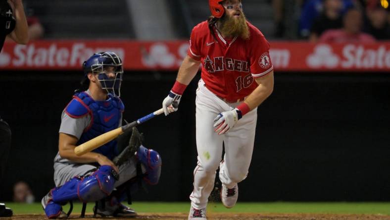 Jul 15, 2022; Anaheim, California, USA;  Los Angeles Angels left fielder Brandon Marsh (16) hits a solo home run in the ninth inning against the Los Angeles Dodgers at Angel Stadium. Mandatory Credit: Jayne Kamin-Oncea-USA TODAY Sports