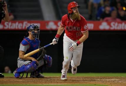 Jul 15, 2022; Anaheim, California, USA;  Los Angeles Angels left fielder Brandon Marsh (16) hits a solo home run in the ninth inning against the Los Angeles Dodgers at Angel Stadium. Mandatory Credit: Jayne Kamin-Oncea-USA TODAY Sports