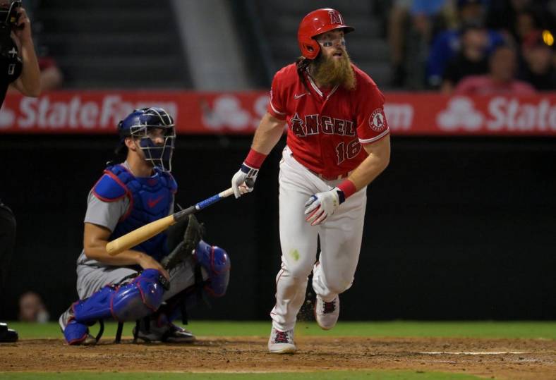 Jul 15, 2022; Anaheim, California, USA;  Los Angeles Angels left fielder Brandon Marsh (16) hits a solo home run in the ninth inning against the Los Angeles Dodgers at Angel Stadium. Mandatory Credit: Jayne Kamin-Oncea-USA TODAY Sports