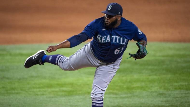 Jul 16, 2022; Arlington, Texas, USA; Seattle Mariners relief pitcher Diego Castillo (63) pitches against the Texas Rangers during the ninth inning at Globe Life Field. Mandatory Credit: Jerome Miron-USA TODAY Sports