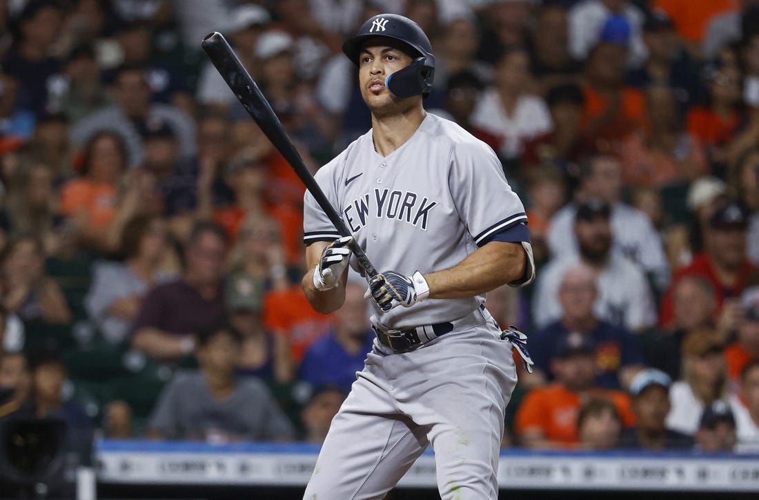 Jul 21, 2022; Houston, Texas, USA; New York Yankees left fielder Giancarlo Stanton (27) reacts after striking out during the eighth inning against the Houston Astros at Minute Maid Park. Mandatory Credit: Troy Taormina-USA TODAY Sports