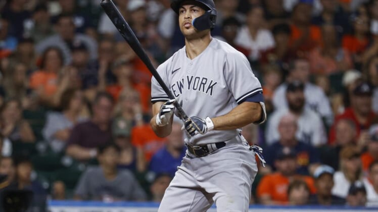 Jul 21, 2022; Houston, Texas, USA; New York Yankees left fielder Giancarlo Stanton (27) reacts after striking out during the eighth inning against the Houston Astros at Minute Maid Park. Mandatory Credit: Troy Taormina-USA TODAY Sports