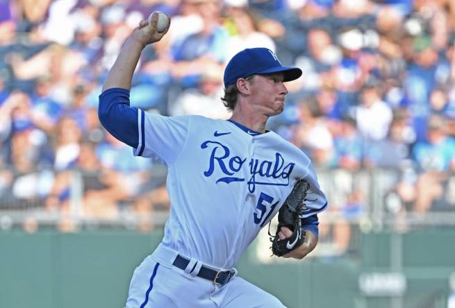 Kansas City Royals starting pitcher Brady Singer throws during the