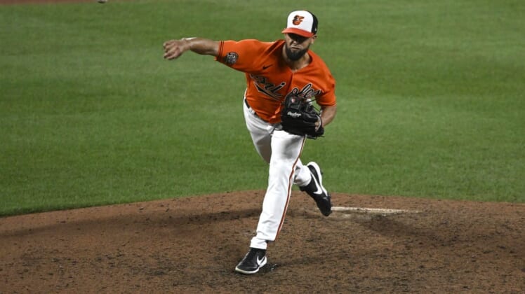 Jul 23, 2022; Baltimore, Maryland, USA;  Baltimore Orioles relief pitcher Jorge Lopez (48) delivers against the New York Yankees in the ninth inning at Oriole Park at Camden Yards. Mandatory Credit: James A. Pittman-USA TODAY Sports